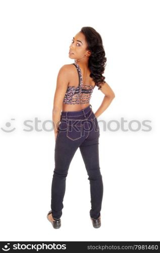 A full length image of a African American women in a colorful top andblue jeans, standing from the back, isolated for white background.