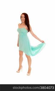 A full length picture of a beautiful young Asian woman in a turquoise longdress, isolated for white background.