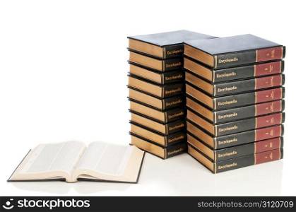 A full set of encyclopedias with one open to a research page.