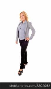 A full size picture of a beautiful blond young woman in a grey blouse andjacket, isolated on white background.