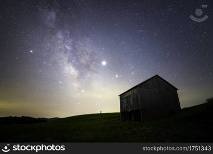 A galactic selfie framed next to a historic fire watchtower atop a meadow just in the Piedmont region of Virginia.