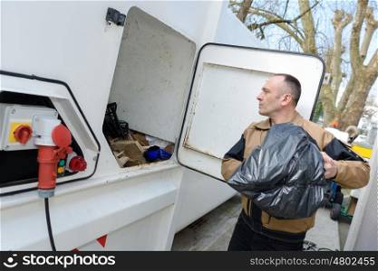 a garbage man working