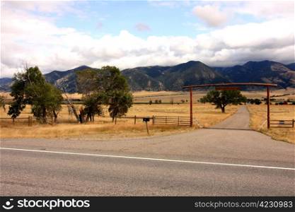 A gate and a fence in mountains, wild west