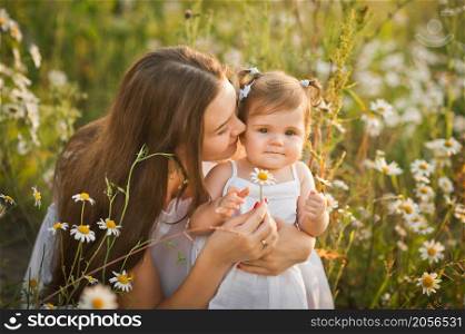 A gentle morning photo among dandelions.. Mother and daughter in a field of dandelions 3005.