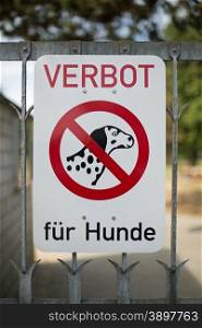 A german sign with the words prohibition of dogs (Verbot fur Hunde)