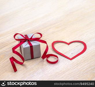 A gift with a heart. Gift wrapping. Holiday present.. Gift wrapping. A gift with a heart. Holiday present.