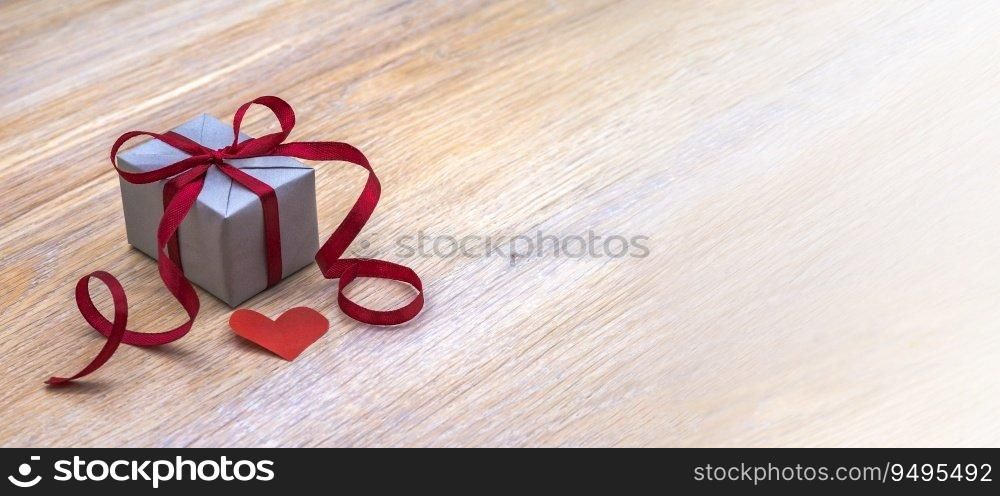 A gift with a heart. Gift wrapping. Holiday present.. Gift wrapping. A gift with a heart. Holiday present.