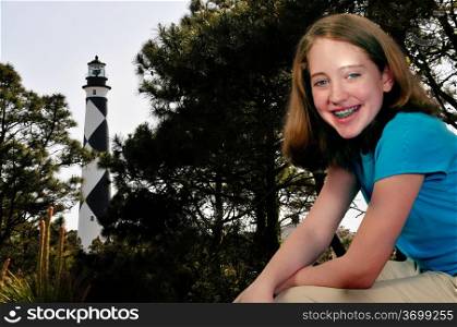 A girl at the Cape Lookout Lighthouse on the North Carolina Coast