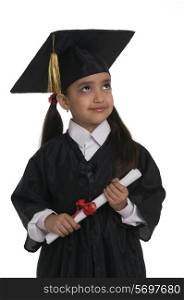 A girl dressed in a convocation attire
