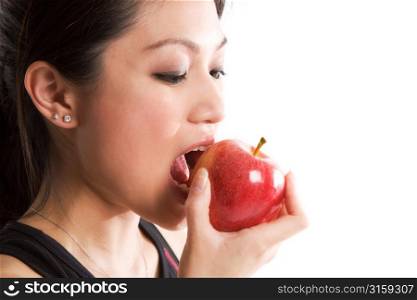 A girl eating an Apple