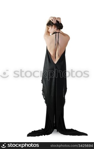 A girl from behind in elegant evening dress, over white,vertical shot