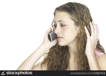A girl gets frustrated talking on the telephone