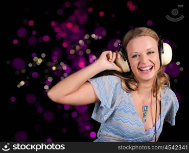 A girl having fun on the background of bright lights in the disco