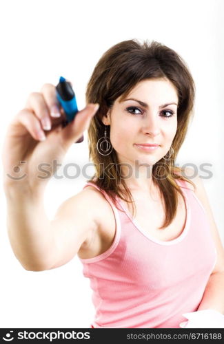 A girl in t-shirt with blue pen writing something in the air