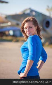 A girl portrait on a old airplane background