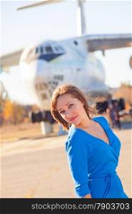 A girl portrait on a old airplane background