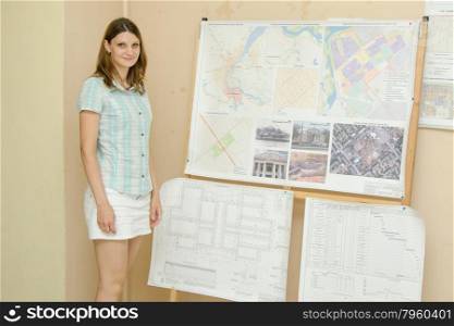 A girl student of European-style protects the thesis project. She is a student at the graduation project
