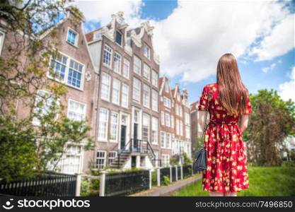 A girl walks through the streets of Amsterdam