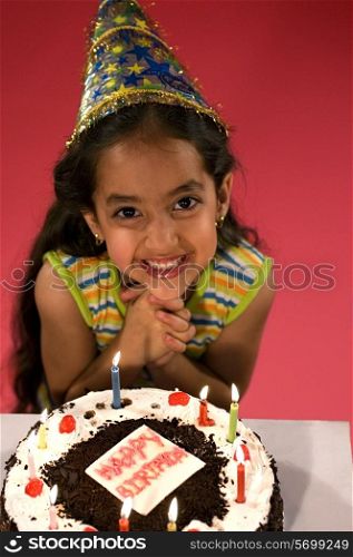 A girl with her birthday cake