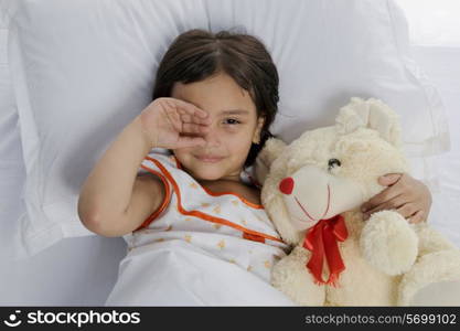 A girl with her teddy bear
