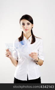 A girl with the map of the world printed on a transparent material