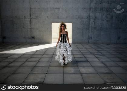 A glamorous woman modern concrete courtyard