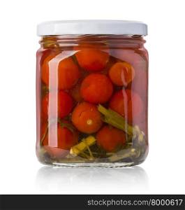A glass jar of canned tomatoes on white background with clipping path