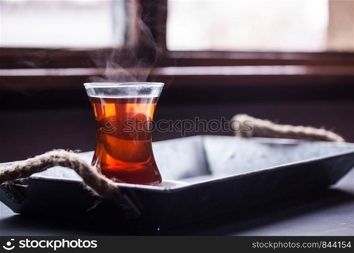 A glass of black tea