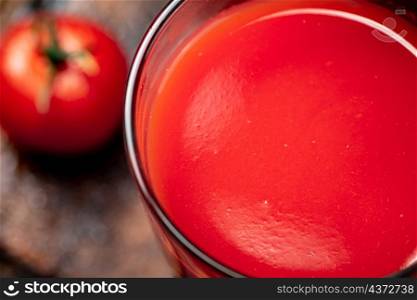 A glass of fresh tomato juice. Texture of tomato juice. High quality photo. A glass of fresh tomato juice.