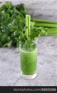 A glass of freshly made celery smoothie. A detox drink for those who care about health.
