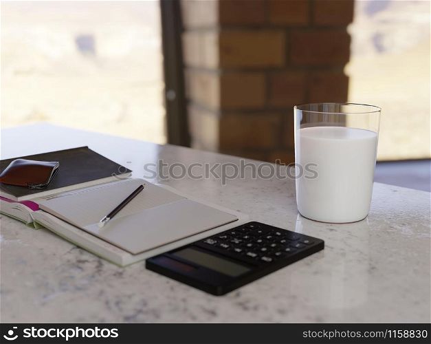 A glass of milk on table in home office.
