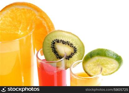 a glass of orange juice with cut fruits