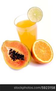 a glass of orange juice with cut fruits