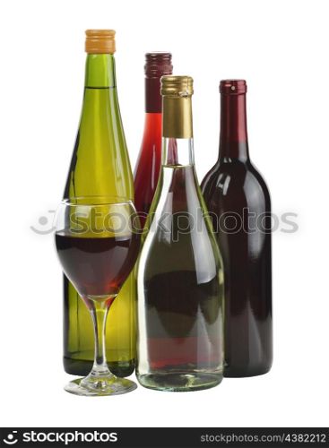 A Glass Of Red Wine And Wine Bottles Isolated On White