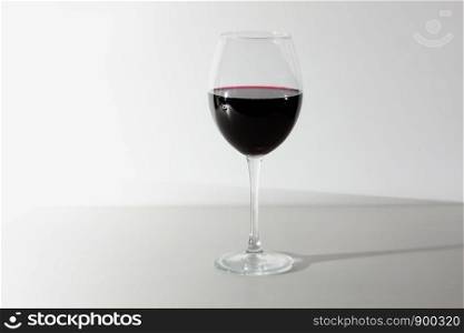 A glass of red wine. Copy space. Concept restaurant, alcohol, party. Glass of red wine isolated on white background. A glass of red wine. Copy space.
