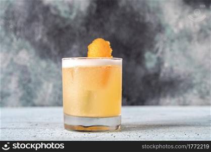 A glass of whiskey sour cocktail close up