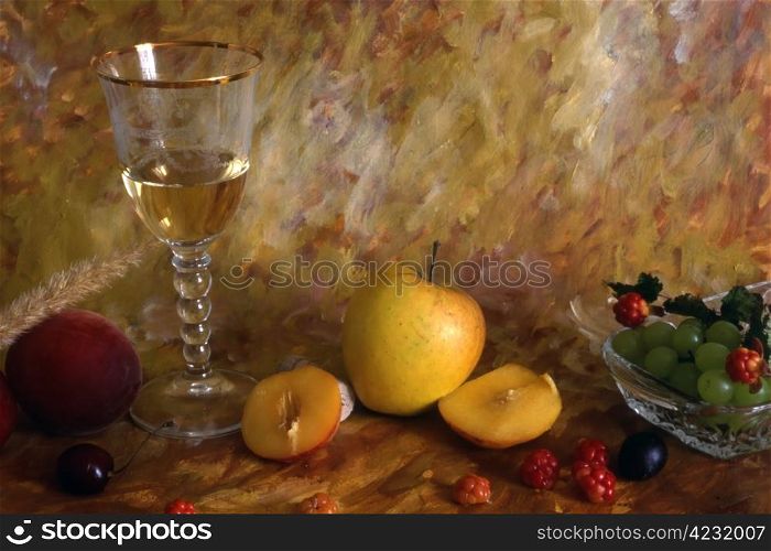 A glass of white wine with multi fruits