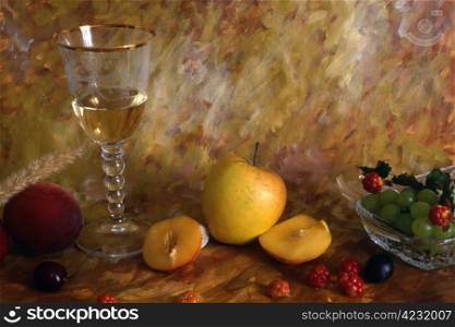 A glass of white wine with multi fruits