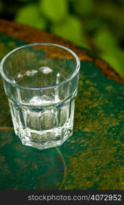 A glass on a green table