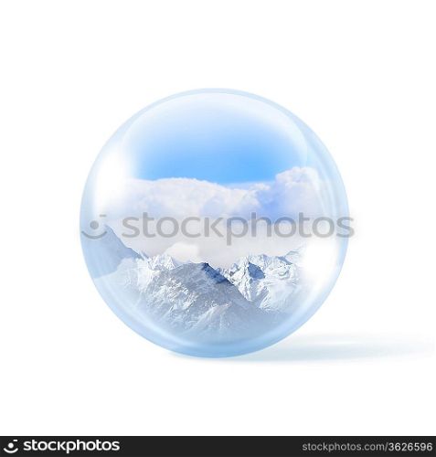 A glass transparent ball with snow high mountains inside it.