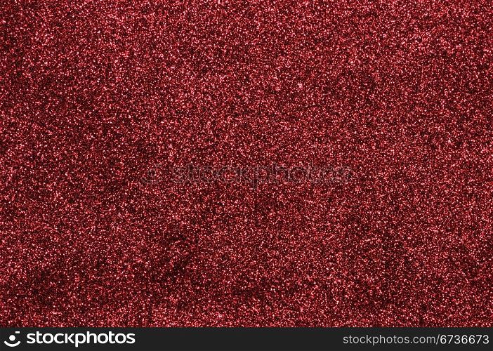 A glittery red paper decorative background