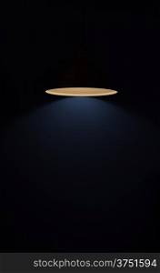 A glowing lamp in a dark room
