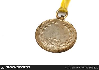 A gold medal isolated on white with space foe text