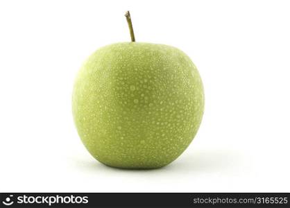 A green apple covered in water droplets