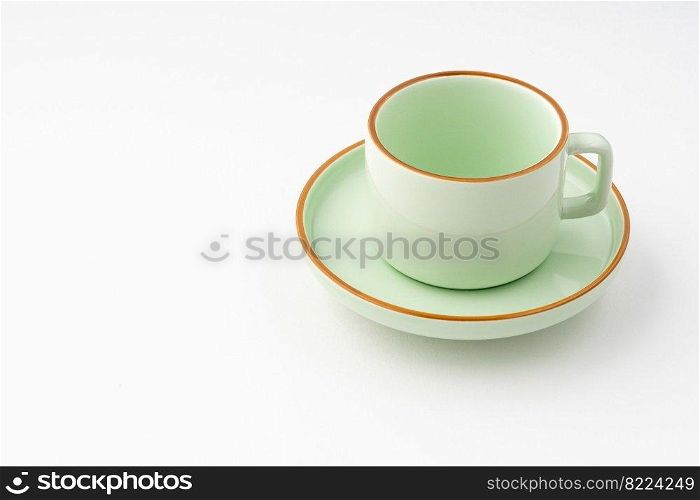 A green ceramic tea cup isolated on white background. Green ceramic tea cup isolated on white background