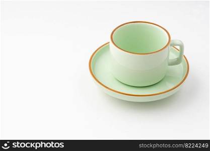 A green ceramic tea cup isolated on white background. Green ceramic tea cup isolated on white background