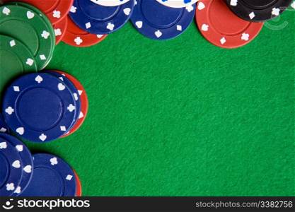 A green felt background with poker chips
