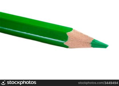 A green pencil expanded very sharp on a white background