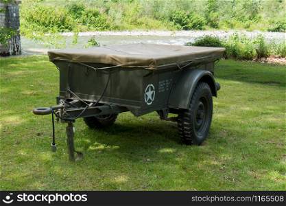a green trailer for a military vehicle