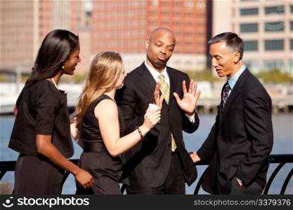A group of business people outdoors in a discussion